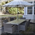 L01. Outdoor patio dining table with six chairs and umbrella. 30”h x 76”l x 36”w 